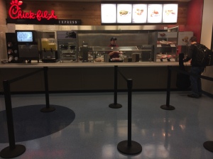 Chik-fil-a employee waits for students